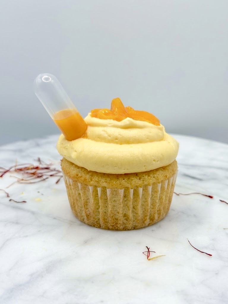 Mango Lassi cupcake with saffron cream, Kesar mango chunks, and a pipette of mango puree